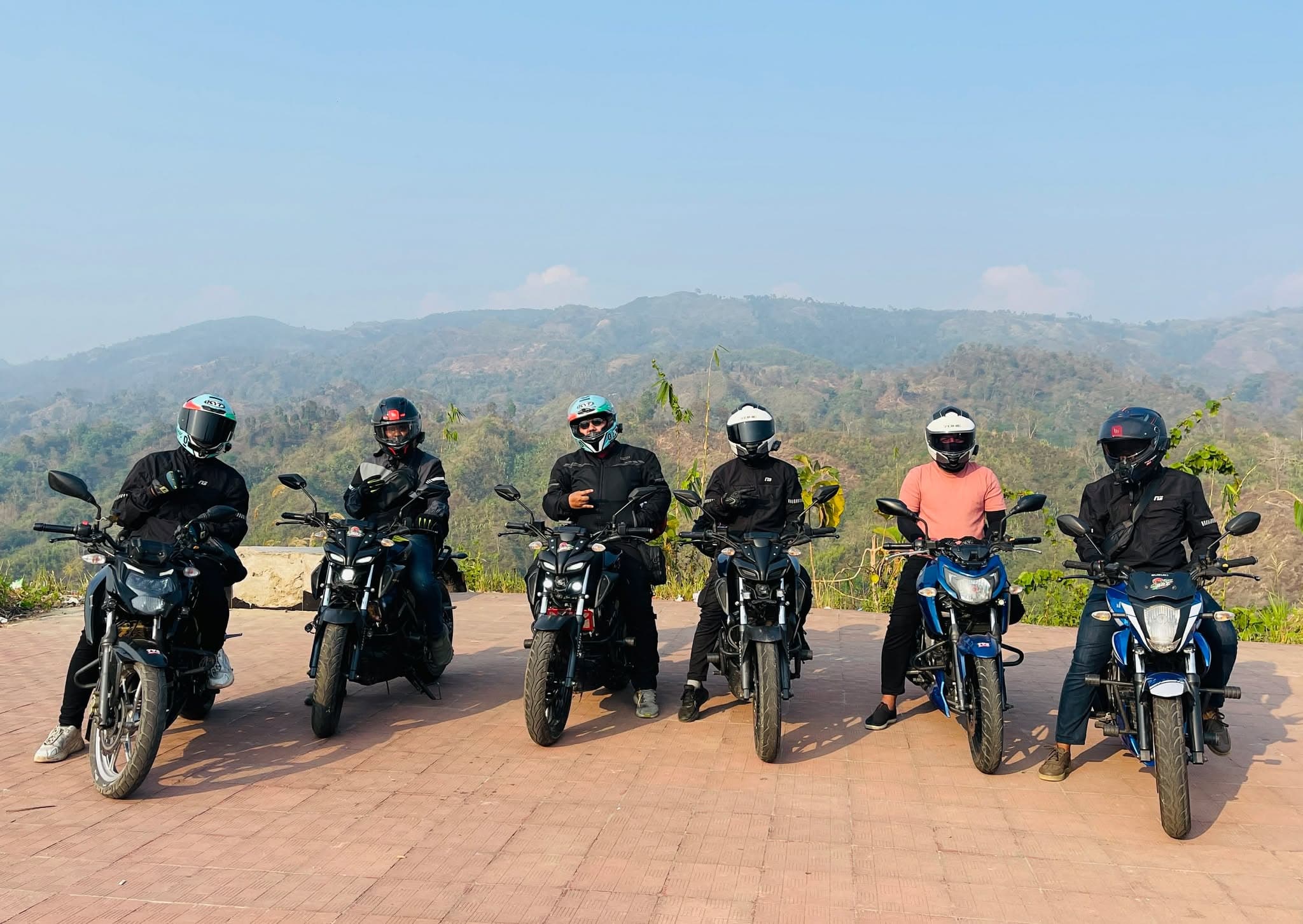 Team Brz riders stopped on a hill tour